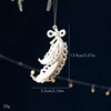 Ornement de Noël en plumes de ton or blanc (1 pièce)