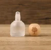 Tapa de madera blanca de 10 ml con logo del Árbol de la Vida.