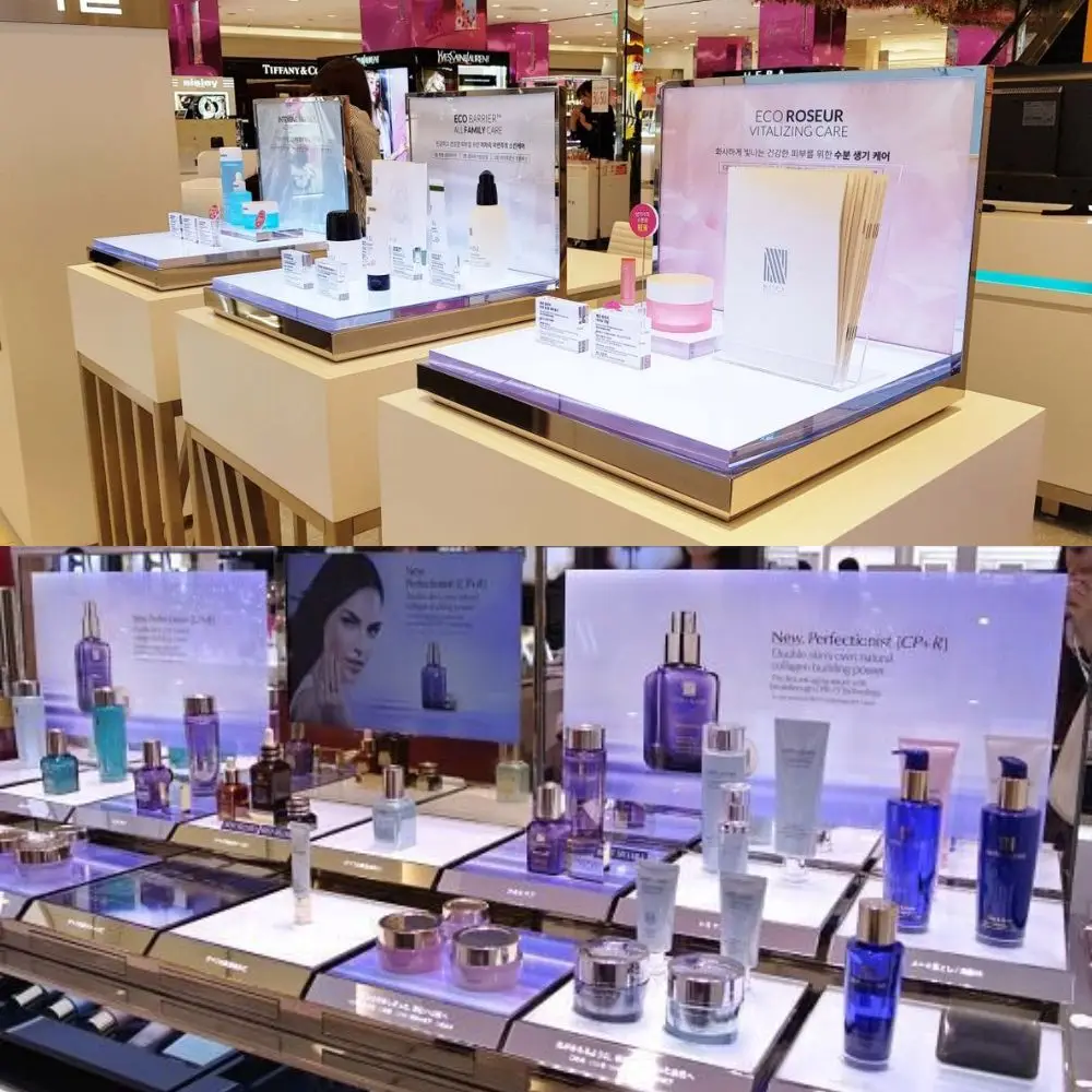 Premium custom illuminated cosmetic display fixtures deployed in a luxury department store boutique counter