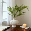 White bougainvillea vase with green golden willow branch