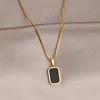 Gold rectangular letter necklace