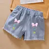 Shorts con nodi rosa e gialli