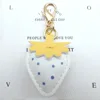 White and yellow leaf lobster clasp