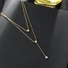 86075 - Chaîne double en or avec trois diamants