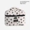 Bolso bombonera con lazo blanco y negro.