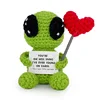 Alien holding a heart