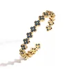 Bracciale quadrifoglio con diamanti blu dorati