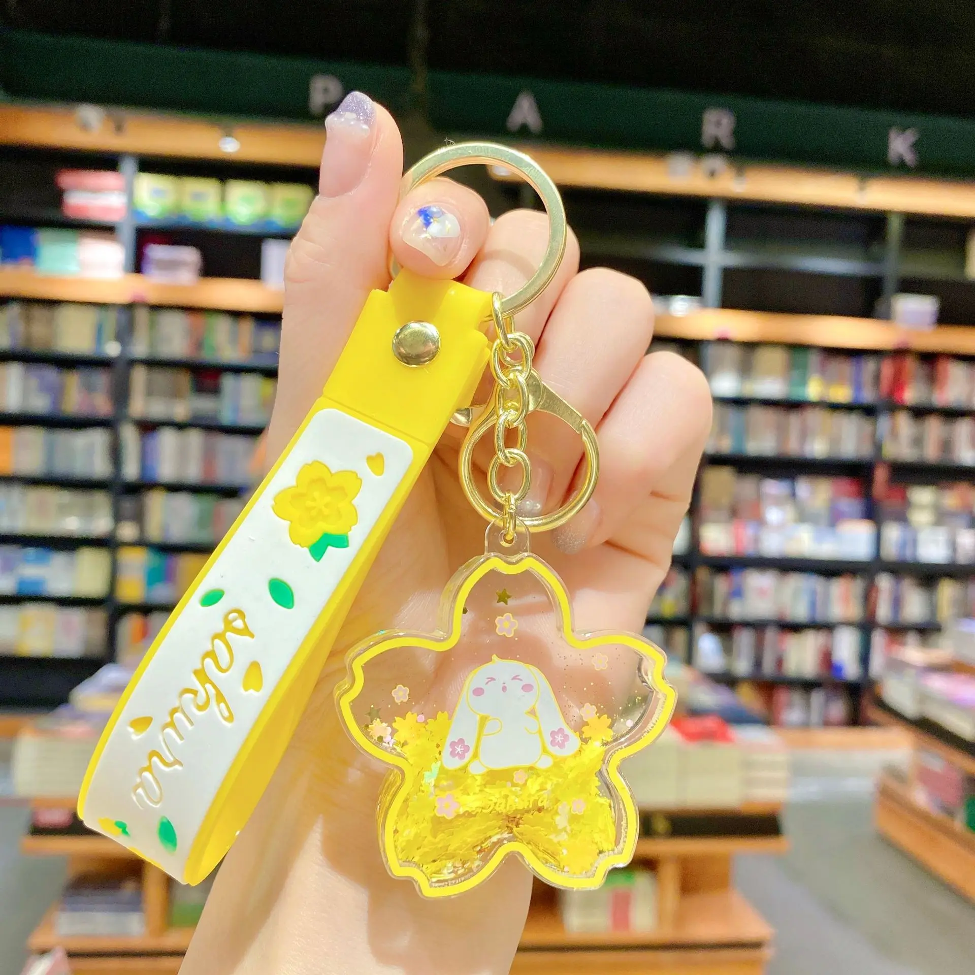 クリエイティブな浮遊桜ウサギキーホルダー、液体オイルウサギが動く