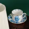 Handprint cup and saucer