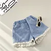 Shorts in pizzo con dettagli in pizzo