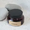 Amber with black cap