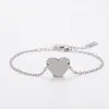Pulsera de cadena con cruz y corazón con agujero interior plateado