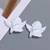 White single-handed cheek-resting angel