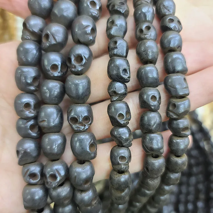 OB112 Tiny Hand Carved Ox Bone Skull Ghost Beads