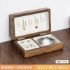 Medium-sized black walnut jewelry box with white velvet fabric.