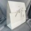 White kraft envelope with ribbon