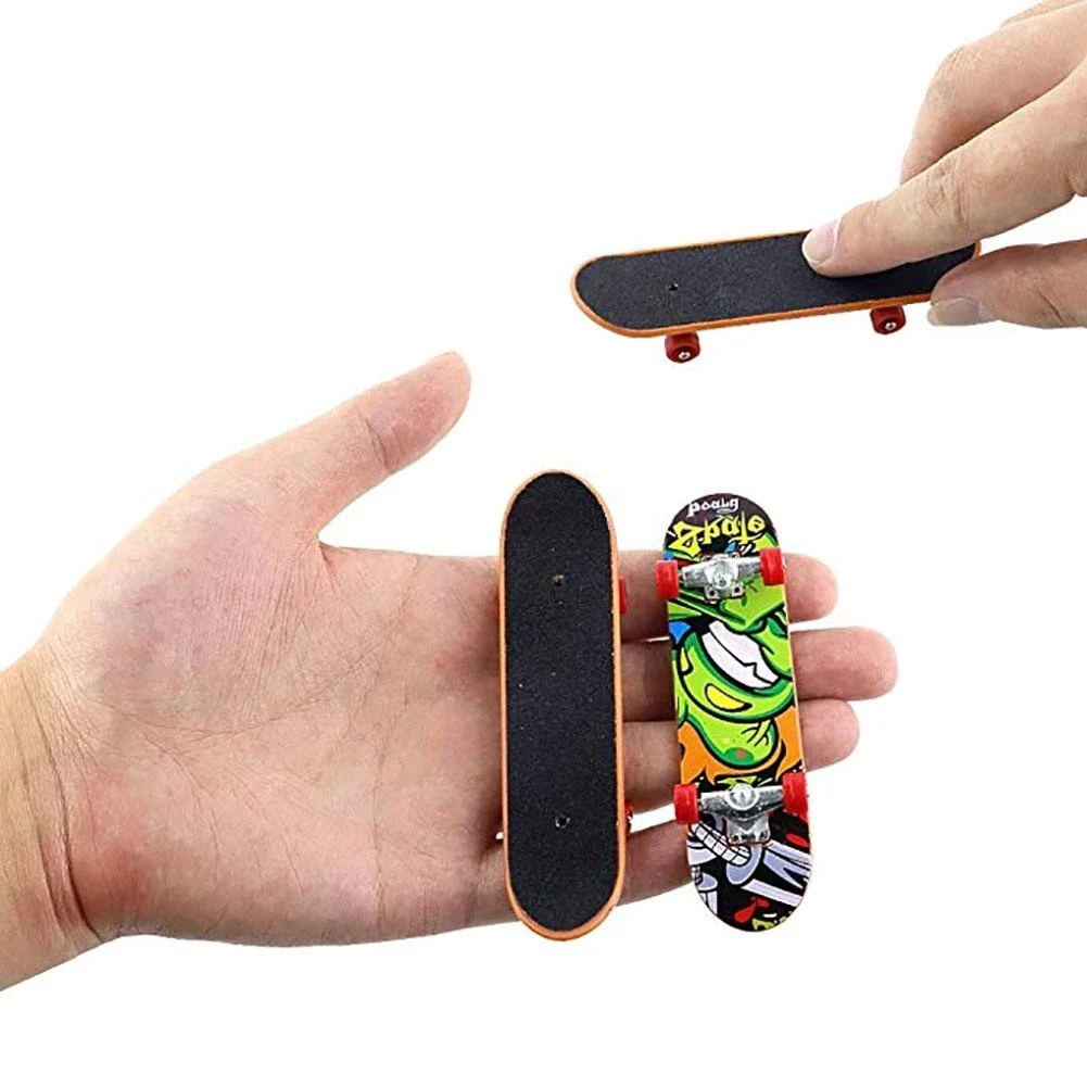Acheter 1 pièces touche Mini doigt planche à roulettes en plastique doigt  patin Scooter retours originaux garçons Mini planche à roulettes jouet