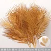 Brown three-pronged palm leaf branch