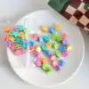 Macaron brillant fleur plate en vrac