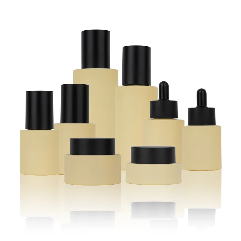 Luxury flat shoulder beige set cosmetic packaging containers serum essential oil lotion pump dropper glass bottle