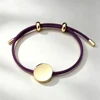 Cordoncino viola scuro + ciondolo dorato