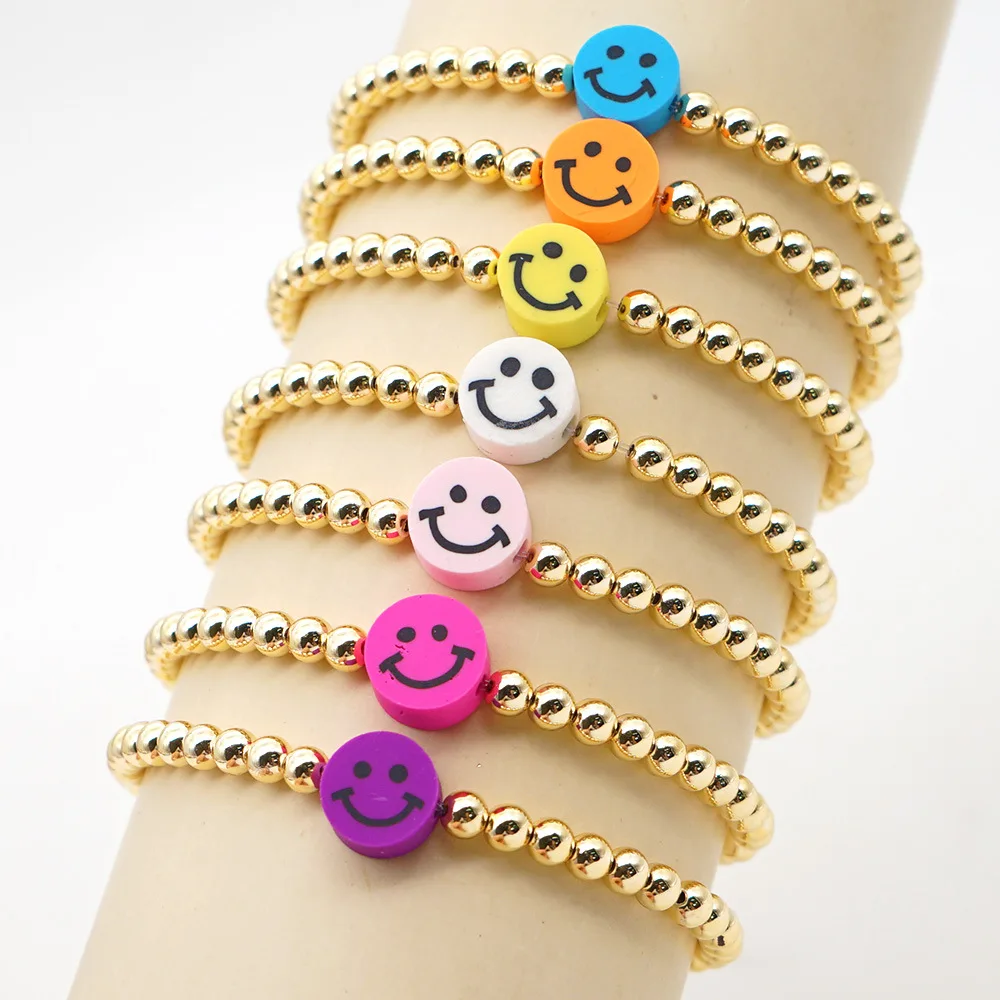 gold beaded bracelet with smiley face