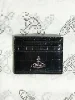 Black alligator-patterned card holder