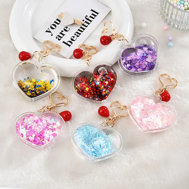 Hot sale heart shape double side transparent plastic keychain glitter fluid acrylic keychain for gifts factory