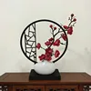 Vertical screen, small white teapot, rose-red plum blossom