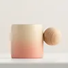 Pink and yellow ball cup