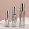 Botella de spray de perfume gris