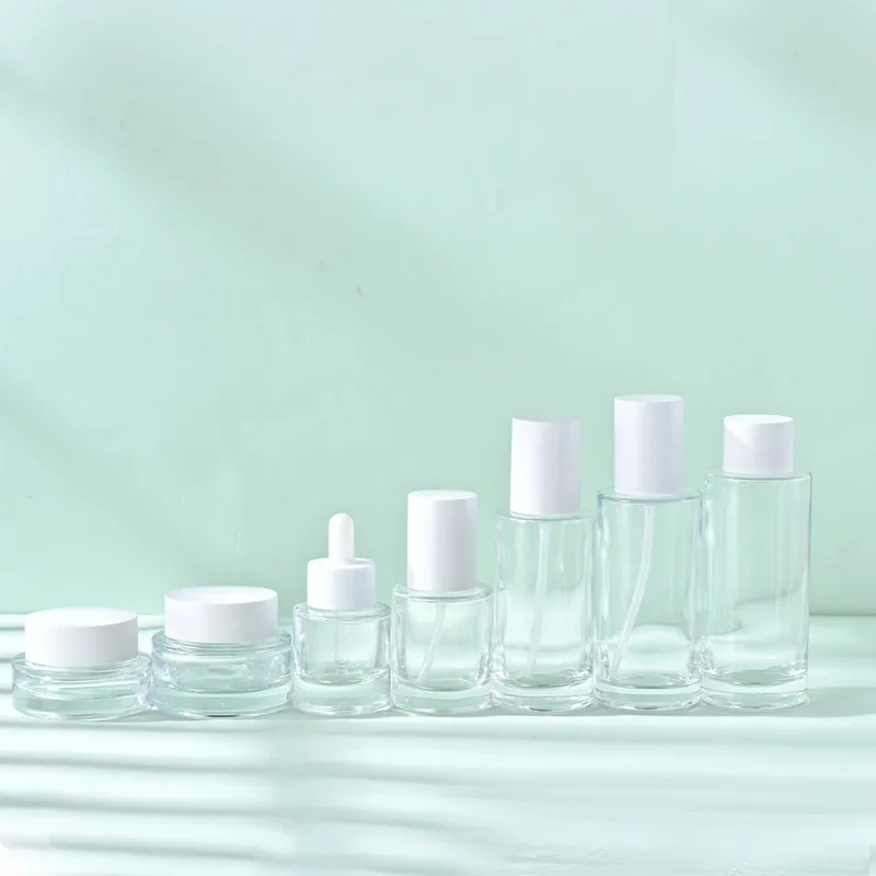 round flat shoulder 30ml 50ml 100ml transparent glass dropper cosmetic pump sprayer cream bottles set skincare packaging supplier