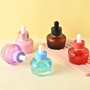 These Uniquely Shaped Premium 30ml 1oz Glass Dropper Bottles Can Be Customized with Any Color and logo