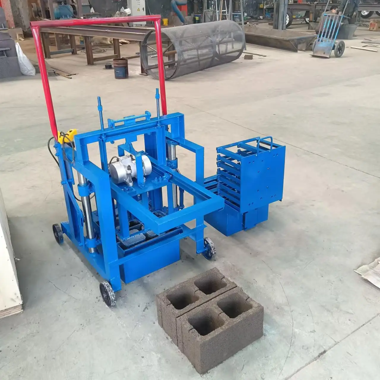 Egg Laying Mobile Manual Brick Machine Concrete Cement Brick Making Machine Small Hollow Block Making Machine for Sale in USA