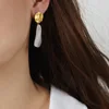 F178-Golden  round white eardrops