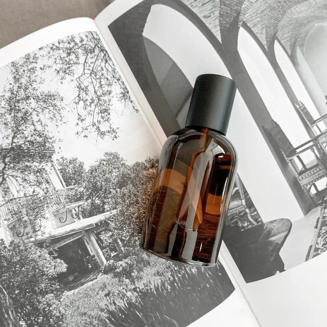 Custom 30ml 50ml 100ml Round Empty Clear Amber Fragrance Perfume Spray Glass Bottles With Black Cap
