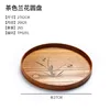 Assiette ronde en bois marron en forme d'orchidée 27cm