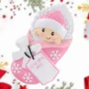 Pink swaddling baby