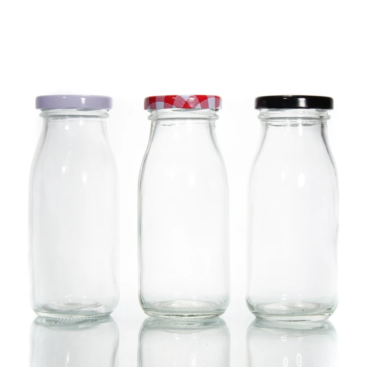 Stocked Cheaper Price Round Clear Milk Bottle Glass for Juice Beverage Packaging