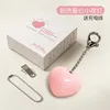 Lampe tactile à double chaîne, forme de cœur rose.