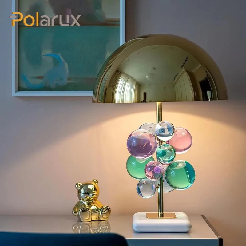 The Globo Table Lamp Consists of a Series of Glass Balls Floating on a Slender Metal Pole with a Metal Dome on Top to Make the