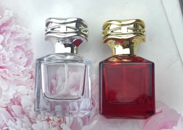 Hot Sale 50ML square Custom Color Red Transparent Perfume Glass Bottle with Flower-shaped Gold and Silver Lid