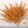 Caramel-colored five-pronged Persian grass branch