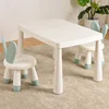 White table, 2 green rabbit chairs, and anti-slip pads included.