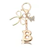 Porte-clés petit papillon doré-B