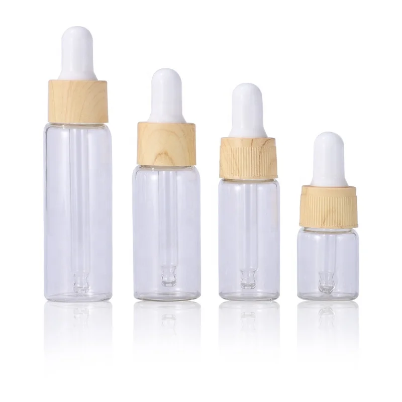 Flacon doseur rond en verre vide avec sécurité enfant, flacon pour sérum, fournisseur de flacons en verre pour soins CBD avec doseur imitation bois de bambou