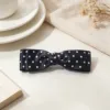 Black polka dot bow design