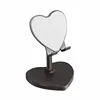 New black plastic heart-shaped stand