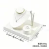 White leather brushed jewelry display stand