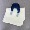 White with blue handle